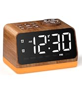 Cylindrical smart alarm clock with digital display showing 8:00 AM. Gray fabric body, illuminated top panel with touch controls including snooze, volume, and playback buttons.