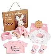 Baby grooming kit with white owl-shaped electric nail trimmer, various attachments, brush, comb, scissors, nasal aspirator, and mesh storage case. Set includes multiple tools for infant care and hygiene.