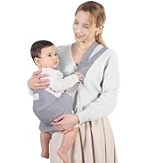 Gray baby carrier being demonstrated with an infant, showing front-carrying position and adjustable straps against a light background.