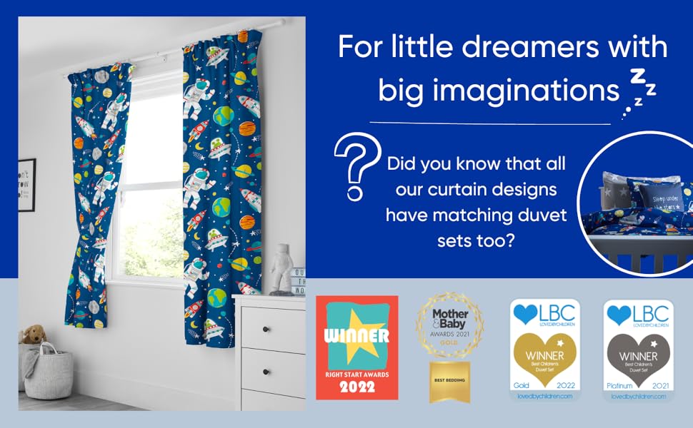 a blue curtain with a planet print on it and a white cabinet with a blue and white background.