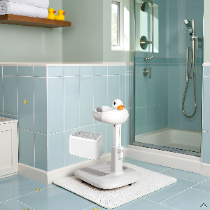 A bathroom scene with a tiled floor and a shower curtain, showcasing the product in use.