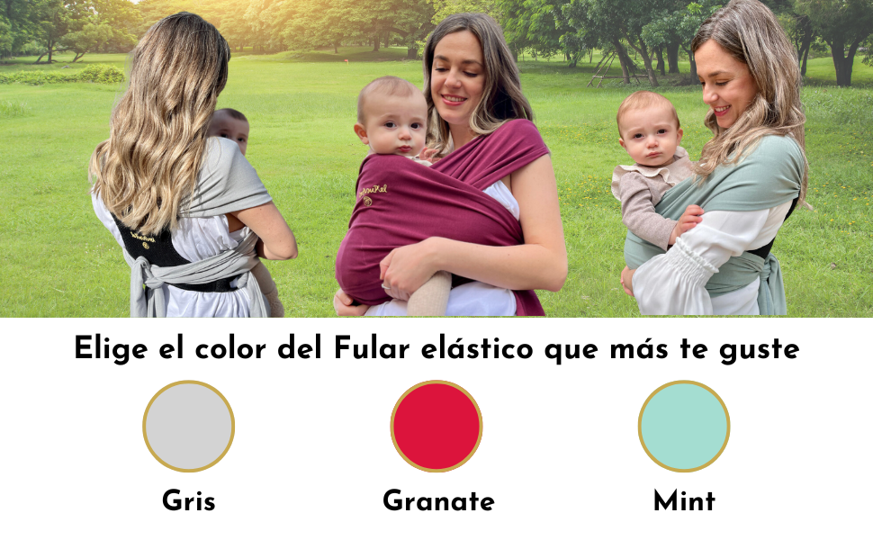 Sage green baby carrier or wrap being worn outdoors, demonstrating front-carrying position with adjustable fabric design.