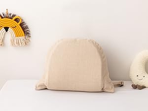 Baby sleeping on patterned bedding. Four icons display product features: breathable, cotton, machine wash, and skin-friendly. Text reads 'KEEP BABY SLEEP SOUNDLY'.