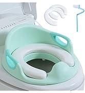 Pink children's toilet training seat shown from multiple angles, featuring ergonomic design with handles and splash guard.