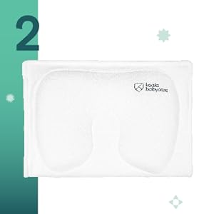 Pale pink, cat-shaped silicone pad or mat with rounded edges. Small heart logo visible in corner. Green background with decorative star shapes.