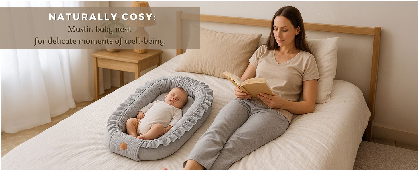 Text reads 'NATURALLY COSY'. Image shows bedroom setting with adult sitting on bed next to infant lounger/nest