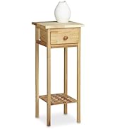 Wooden bathroom storage cabinet with open shelves and louvered door. Features light wood finish, four compartments, and decorative seagull ornament on top. Contains various bathroom items.