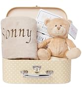 Text reads 'My First Christmas.' Red and white gift box containing plush reindeer toy with red nose and festive Christmas-themed decorative elements.