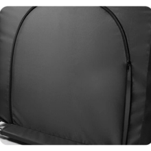 Close-up view of black backpack material showing smooth, matte textured surface and curved design element.