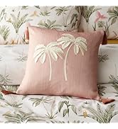 Multiple views of a decorative pillow featuring teal background with butterfly and botanical print pattern in pink and dark colors.