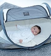 baby in a baby carrier on a deck