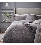 Series of images showing white bedding with decorative trim on a bed against pale blue walls. Includes pillows and duvet cover in bright white finish.