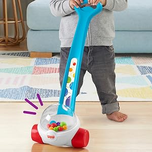 Colorful children's sorting toy set with yellow container base and various shaped blocks being played with.