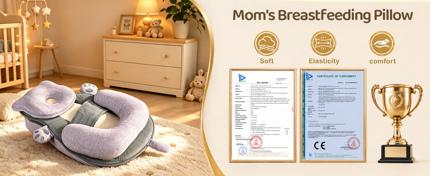 Text reads 'Mom's Breastfeeding Pillow' with award icons and certifications visible. Nursing pillow in gray/mauve displayed in warm bedroom setting with bedside table and decorative elements.