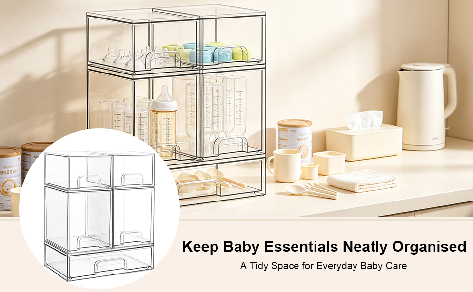 Text reads 'Keep Baby Essentials Neatly Organised A Tidy Space to Everyday Baby Care'. Clear acrylic organizer with multiple compartments containing baby care products including bottles and white containers.