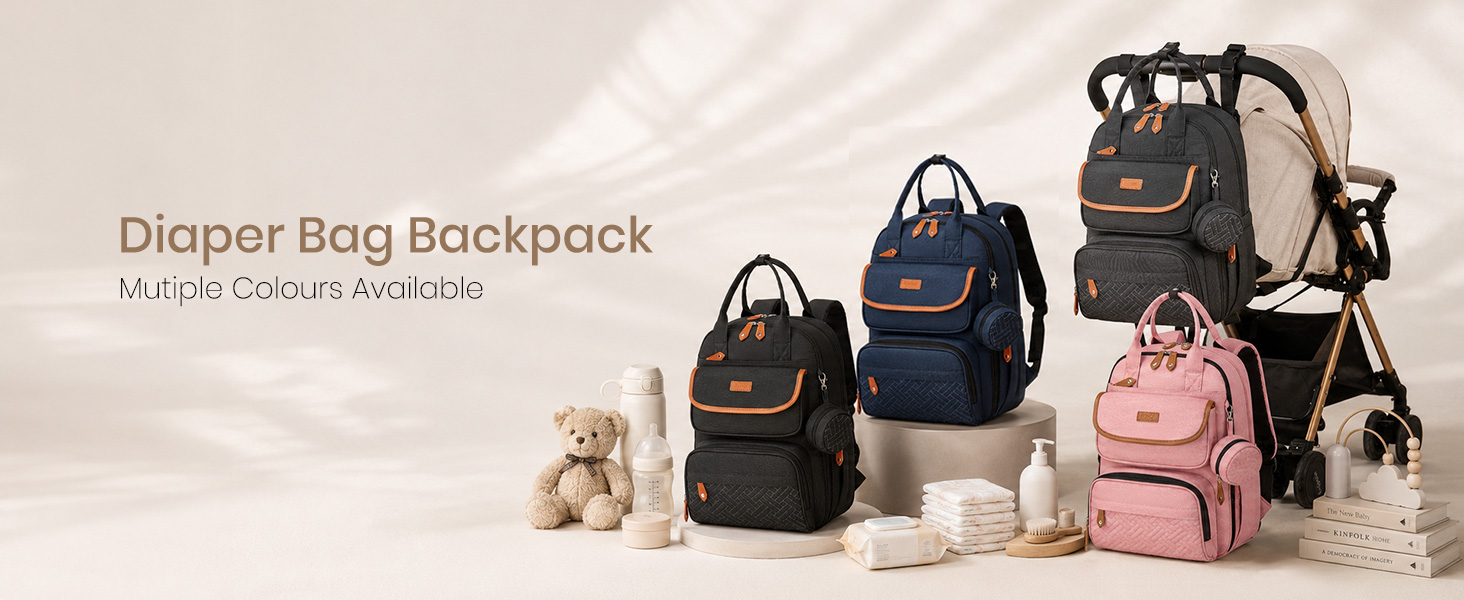 Text reads 'Diaper Bag Backpack'. Three multi-colored diaper bags in black, navy blue, and pink displayed with stuffed toy.